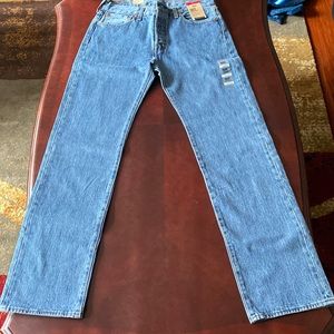 Levis 501 button fly blue jeans. Size 33x34. New with tags.